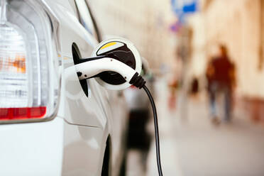 Close-Up Of Electric Car Being Charged - EYF04040