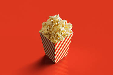 Close-Up Of Popcorn Against Orange Background - EYF04077