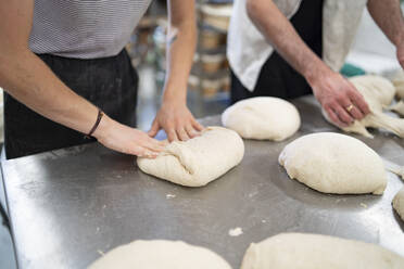 Bakers hands working and weighing bread dough on digital scale Stock Photo  by ©pxhidalgo 114398984