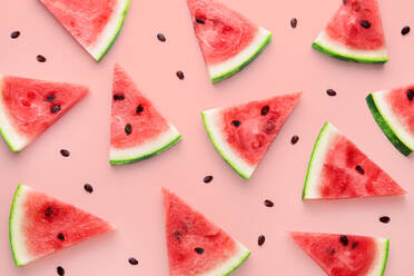 High Angle View Of Watermelon Slices Against Pink Background - EYF04458