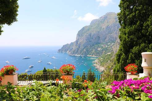 Scenic View Of Sea By Mountains Against Sky - EYF04544