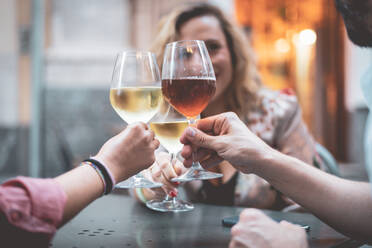 Friends Toasting Wineglasses In Restaurant - EYF04550