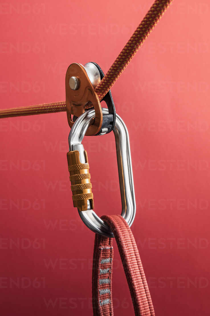 Climbing carabiner on harness loop and rope through pulley stock photo,  rope climbing carabiner