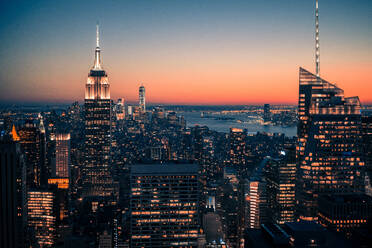 High Angle View Of Illuminated Empire State Building And Cityscape Against Clear Sky At Night - EYF04662