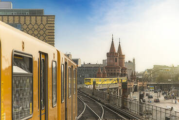 Subway Train On Railroad Tracks By Oberbaumbruecke Against Sky - EYF04710