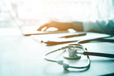 Close-Up Of Stethoscope At Desk In Clinic - EYF04879