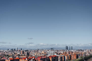 Spain, Madrid, Clear sky over city downtown at dusk - JCMF00580
