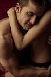 Cropped view of intimate young couple hugging - GMLF00026