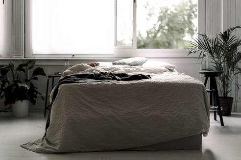 Unmade bed in a loft - ERRF03488