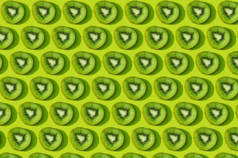 Kiwi fruit pattern on green background stock photo