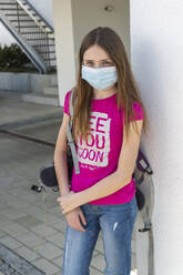 Girl on her way to school with protective mask - SARF04537