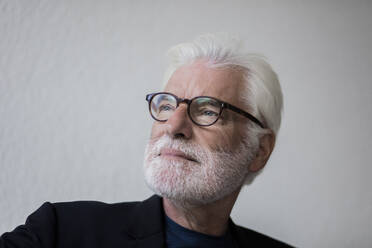 Portrait of bearded senior man with white hair looking at distance - JOSEF00264