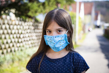 Girl wearing homemade protective mask - LVF08829