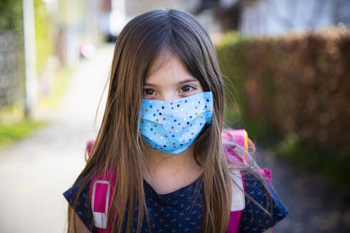 Girl wearing homemade protective mask - LVF08830