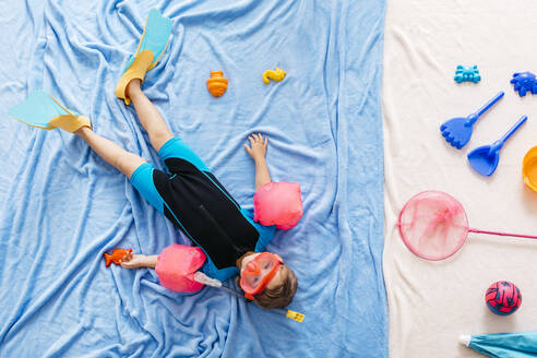 Studio shot of girl swimming in sea - JRFF04337