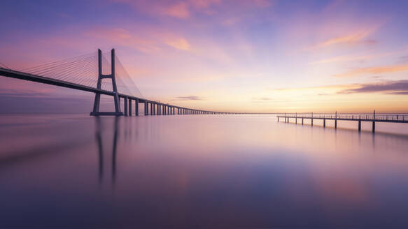 Portugal, Lisbon, Vasco da Gama Bridge at moody sunrise - RPSF00282