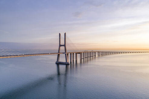 Portugal, Lisbon, Vasco da Gama Bridge at moody sunrise - RPSF00285