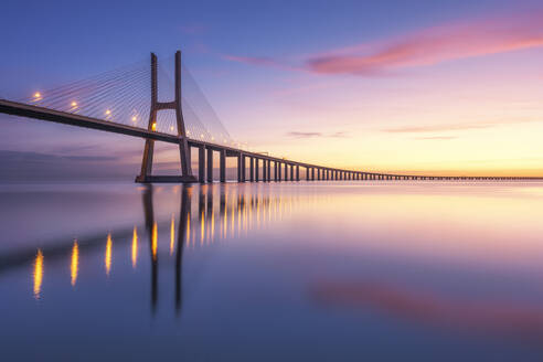 Portugal, Lisbon, Vasco da Gama Bridge at moody sunrise - RPSF00287