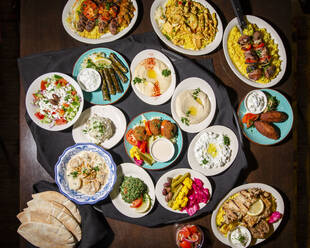 Above-view of a Meditterranean feast spread out on a table - CAVF79234