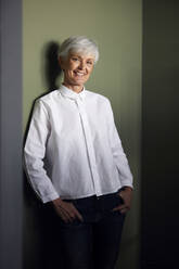 Portrait of smiling senior businesswoman wearing white shirt - RBF07557