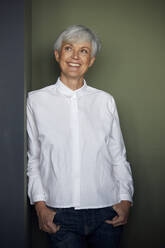 Portrait of smiling senior businesswoman wearing white shirt - RBF07558
