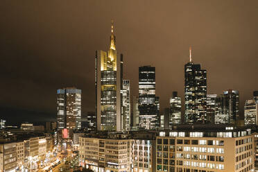 Germany, Hesse, Frankfurt, Illuminated city downtown at night - AHSF02336