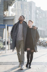 Young couple walking in the city, Milan , Italy - MEUF00415