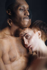 Double exposure portrait of nude young couple in studio - MEUF00541