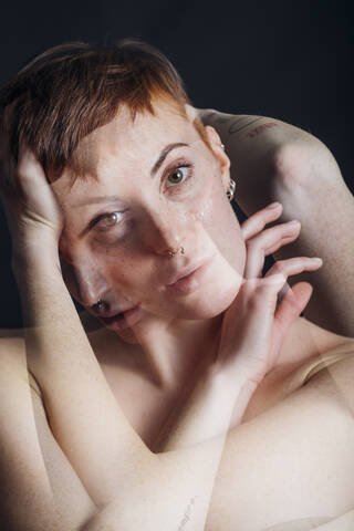 Double exposure portrait of nude young woman in studio stock photo