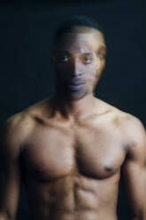 Double exposure portrait of nude young man in studio - MEUF00547