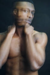 Double exposure portrait of nude young man in studio - MEUF00548