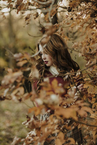 Fashionable woman in autumnal nature stock photo
