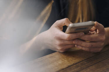 Close-up of woman using smartphone - GUSF03537