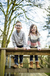 Cute portrait of boy and girl playing at the park. - CAVF79373