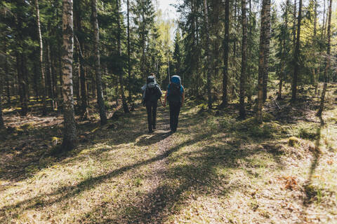 Young people hiking in forest, Sormlandsleden, Sweden stock photo