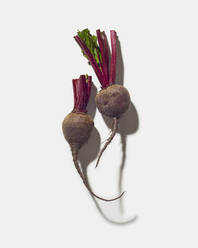 Two Trimmed beets on white - CAVF79626