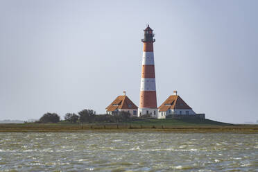 Germany, Schleswig-Holstein, Westerhever, Westerheversand Lighthouse standing against clear sky - WIF04255