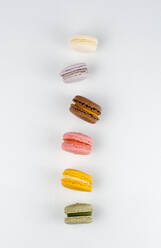 Macarons in action on white background - CAVF79978