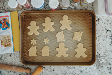 Overhead shot of cut out cookies on a baking sheet - CAVF79992