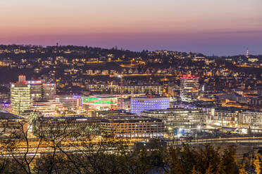 Germany, Baden-Wurttemberg, Stuttgart, Illuminated city at dusk - WDF05972