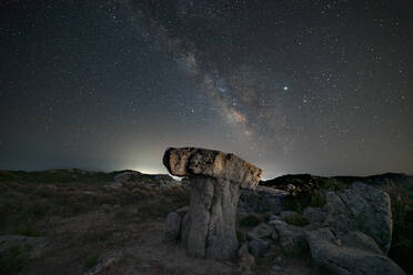 Milky way panorama above a mushroom-shaped rock - CAVF80167