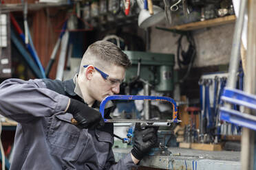 Plumber male working in a workshop - CAVF80243