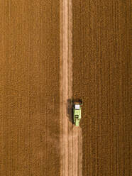 Aerial view of combine harvester on a field of soybean - NOF00084