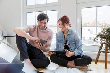 Father and daughter learning together at home - FKF03752