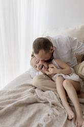 Father cuddling his little daughter - GMLF00143