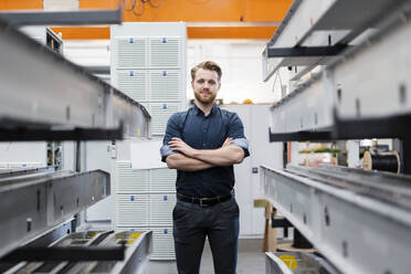 Portrait of a confident young man in a factory - DIGF10019