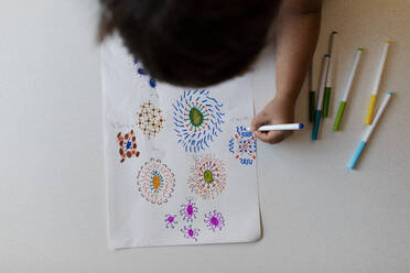 Crop view of little boy drawing flowers - VABF02838