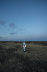 Spacewoman on meadow in the evening - VPIF02387