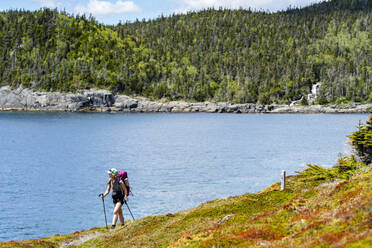 Female Backpacking Along East Coast Trail In Newfoundland - CAVF80627