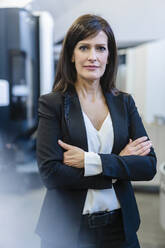 Portrait of a confident businesswoman in a factory - DIGF10108